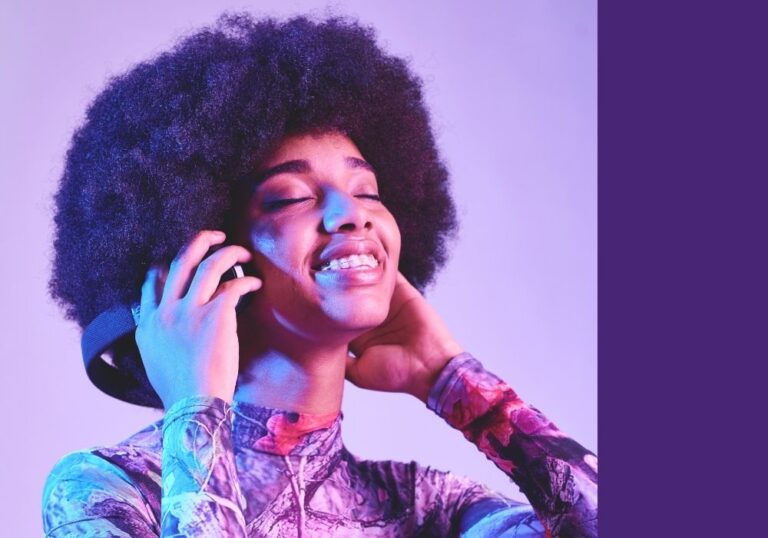 Woman listening to music ensuring her brand is compliant with properly licensed music